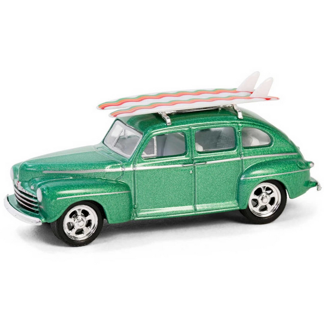 Greenlight 1/64 The Hobby Shop Series 16 - 1946 Ford Fordor Super Deluxe Green Metallic with White Interior and Roof Rack with Surfboards